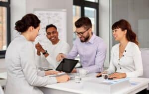 team of recruiters with tablet pc at job interview
