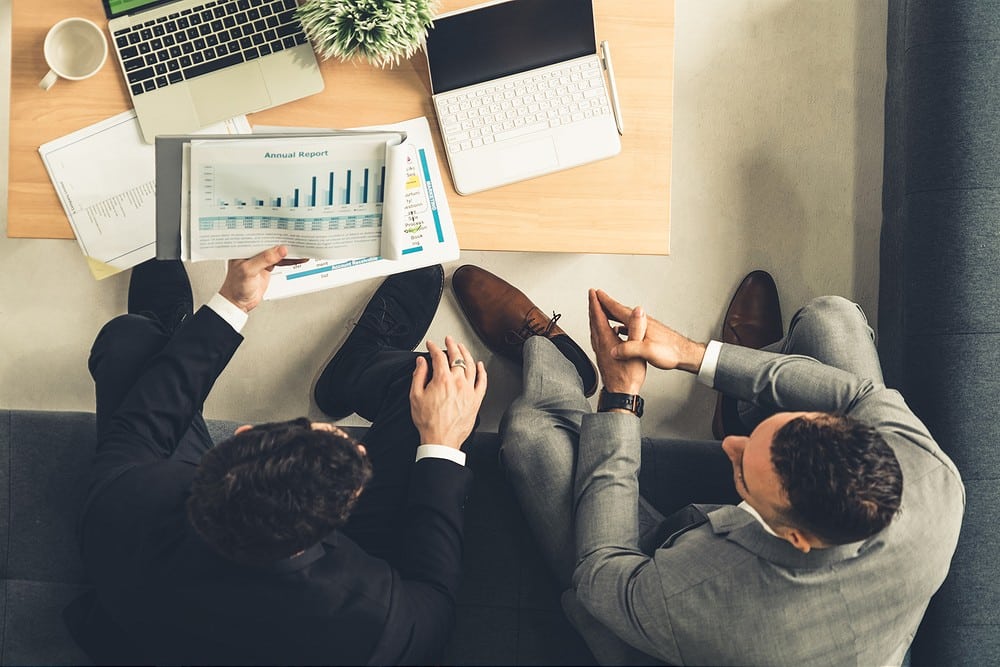 Businessmen are in business meeting in office.